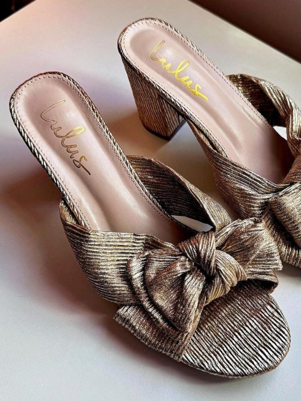 Gold metallic Lulu’s bow mules